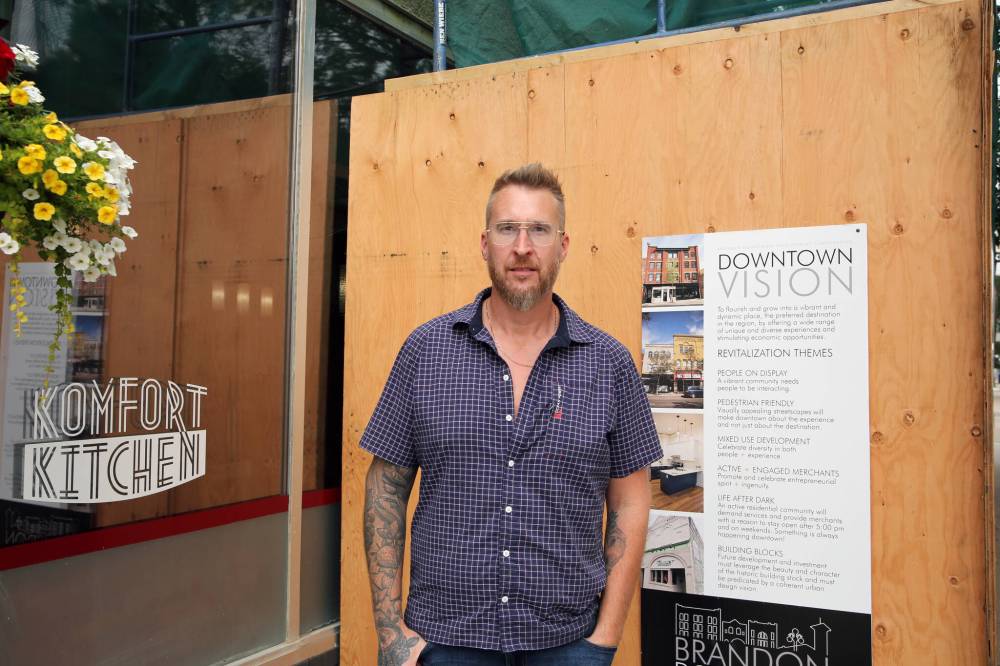 Komfort Kitchen owner-operator Derek Woychyshyn stands near an exterior section of his restaurant currently under renovation. Some funding for the renovations was provided through the Brandon Downtown Revitalization Incentive Program offered through the Brandon Downtown Development Corporation. (Colin Slark/The Brandon Sun)