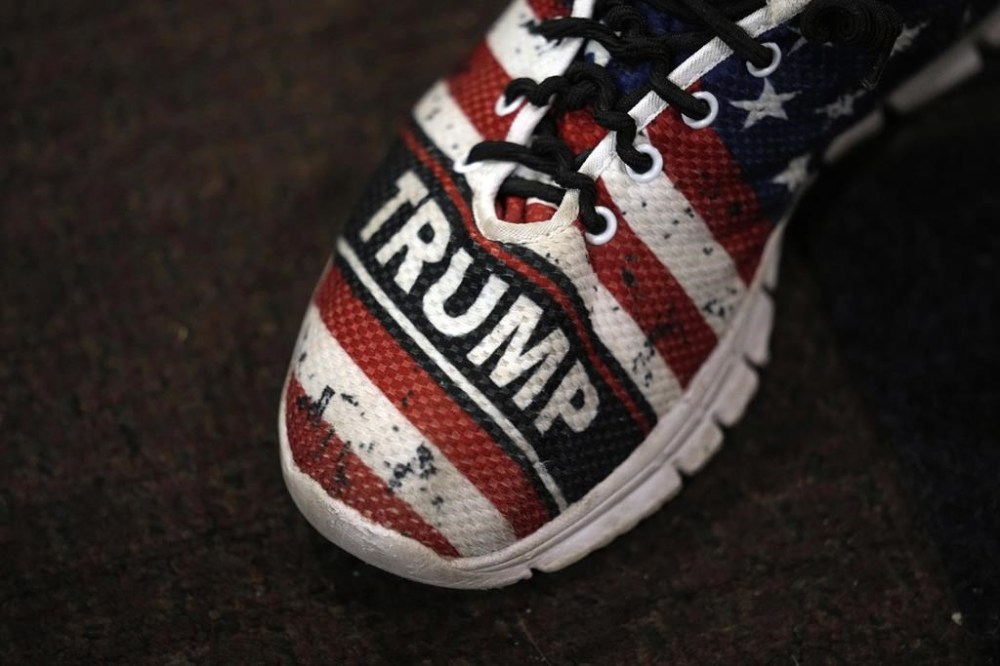A supporter arrives to see former President Donald Trump during his visit with campaign volunteers at the Grimes Community Complex Park, Tuesday, July 18, 2023, in Des Moines, Iowa. (AP Photo/Charlie Neibergall)