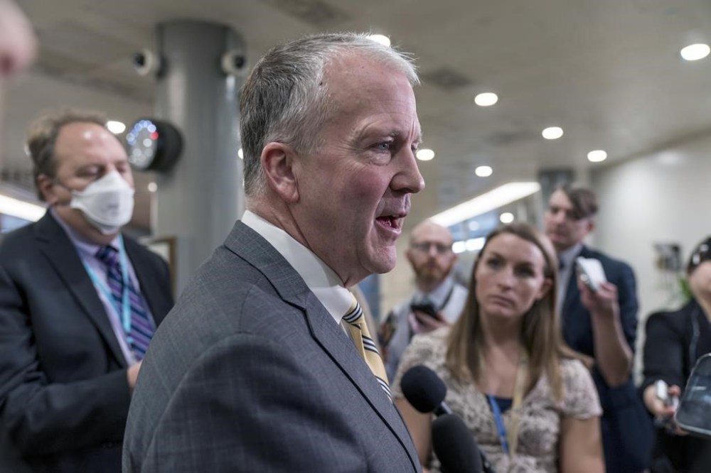 Sen. Dan Sullivan, R-Alaska, talks to reporters after a closed-door briefing on the Chinese surveillance balloon that flew over the United States recently, at the Capitol in Washington, Thursday, Feb. 9, 2023. Canada is again in the U.S. spotlight for what one Republican senator is calling its