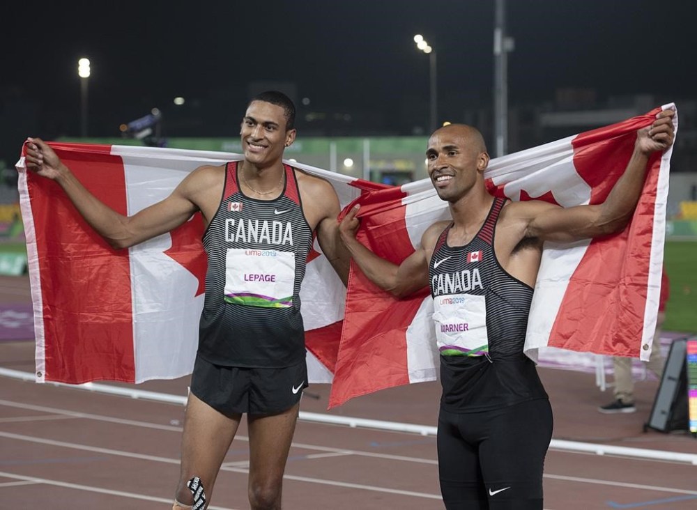 Canada's Damian Warner, right, celebrates his gold medal win in the decathlon with teammate Pierce LePage who won bronze at the Pan Am Games in Lima, Peru on Wednesday, Aug. 7, 2019. THE CANADIAN PRESS/Andrew Vaughan