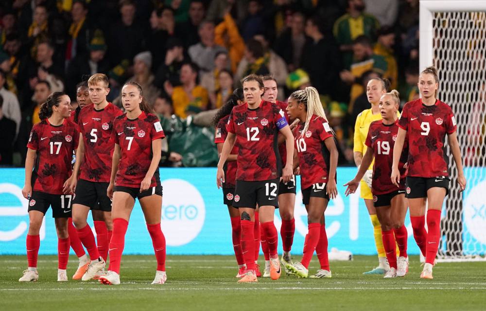 Canada’s Christine Sinclair (12) and teammates react after conceding the second goal of the first half during Group B soccer action against Australia at the FIFA Women’s World Cup in Melbourne, Australia, Monday, July 31, 2023. THE CANADIAN PRESS/Scott Barbour