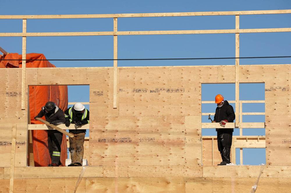 Construction workers are shown at construction on an apartment building on Pacific Avenue. Brandon City Council is contemplating changes to its pending development cost charge bylaw when it comes to high-density housing. (File)