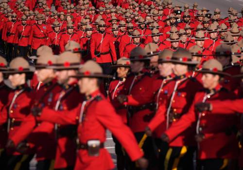 RCMP officers in red serge march at a regimental funeral, in Richmond, B.C., on Nov. 2, 2022. Decisive action is needed to address a culture that protects officers who have committed sexual misconduct — within the RCMP and law enforcement agencies everywhere else — writes Jason Walker. (File)