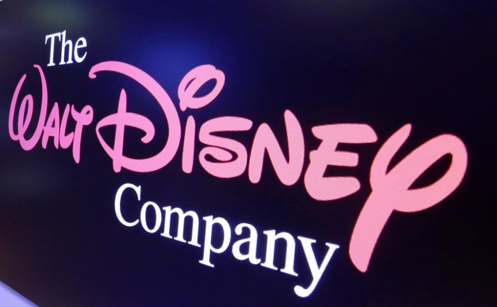 FILE - The Walt Disney Co. logo appears on a screen above the floor of the New York Stock Exchange on Aug. 7, 2017. Disney reported narrower losses on its Disney+ streaming platform in the quarter ended July 1, 2023, and boosted revenues, but also shed Disney+ subscribers for the second quarter in a row. (AP Photo/Richard Drew, File)