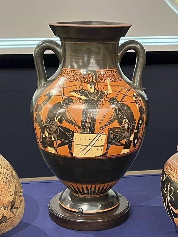 In this picture made available by the Italian Carabinieri, paramilitary police, Friday, Aug. 11, 2023, some of the 266 266 antiquities returned from the United States to Italy are displayed during a handing over ceremony t the offices of the Manhattan district attorney. Italy on Friday celebrated the return of 266 antiquities from the United States, including Etruscan vases and ancient Roman coins and mosaics worth tens of millions of euros (dollars), that were looted from Italian soil and sold to U.S. museums and private collectors. (Italian Carabinieri Via AP)