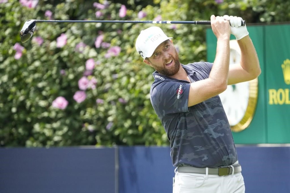 Chris Kirk watches his tee shot on the first hole during the third round of the BMW Championship golf tournament, Saturday, Aug. 19, 2023, in Olympia Fields, Ill. (AP Photo/Charles Rex Arbogast)