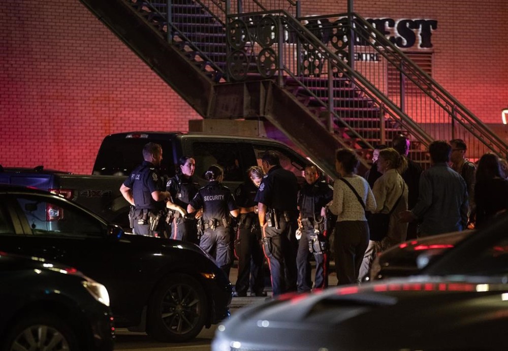 Police investigate the scene of a multiple shooting at West Edmonton Mall in Edmonton, on Monday Aug. 21, 2023. Police say three people were seriously injured and taken to hospital. THE CANADIAN PRESS/Jason Franson