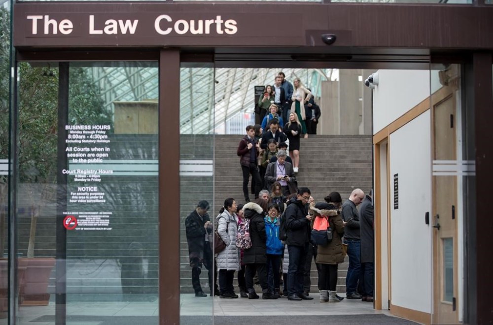 The mother of a 13-year-old girl found dead in a British Columbia park six years ago has told a murder trial how she gave her a last hug, hours before the girl's death. Members of the media and public line up to enter a courtroom at B.C. Supreme Court, in Vancouver, B.C., Tuesday Jan. 21, 2020. THE CANADIAN PRESS/Darryl Dyck