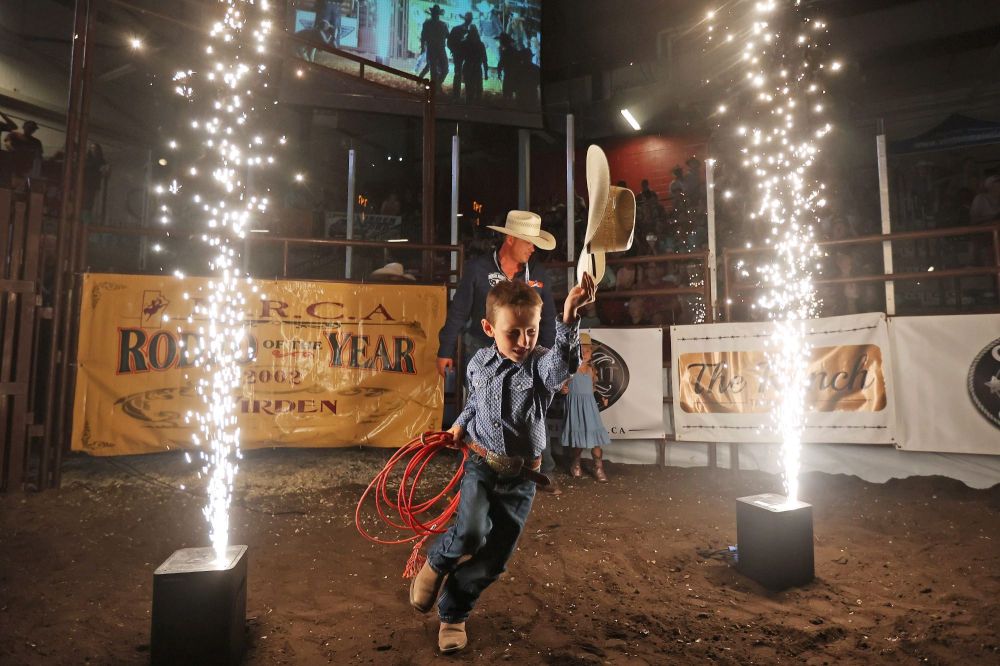 A young cowboy runs into the rodeo arena during the opening ceremonies at the Friday night go round of the Virden Indoor Rodeo at Tundra Oil & Gas Place. (Tim Smith/The Brandon Sun)