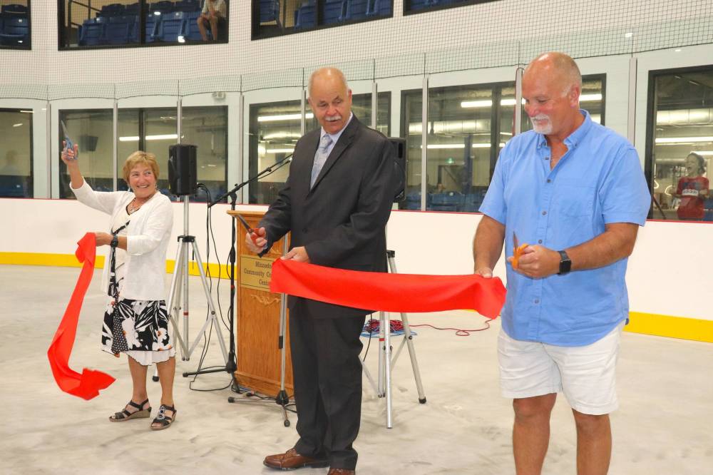 Heather Lewis, Minnedosa Mayor Ken Cameron and Minnedosa Recreation and Events Centre committee member Scott Burgess take part in a ribbon cutting ceremony at the community's new Sunrise Credit Union Centre this past Saturday afternoon. Lewis' late husband Jon was a key figure in getting this project off the ground and was working towards its completion before his untimely death last November. (Kyle Darbyson/The Brandon Sun)