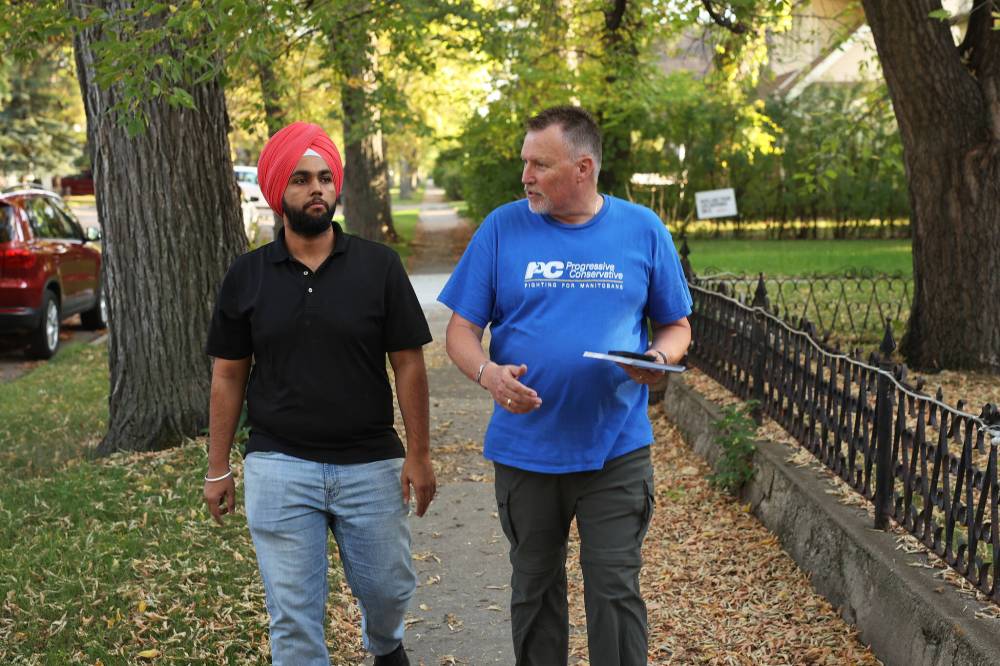 Brandon East Progressive Conservative candidate Len Isleifson goes door-knocking along with volunteer Ajay Dhindsa on 16th Street in Brandon to introduce himself to voters in this file image. (The Brandon Sun)