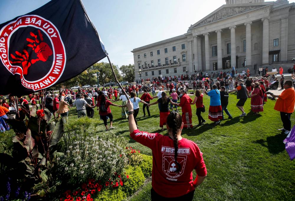 Supporters and family do a round dance as they gather at a rally to search Winnipeg landfill for three missing women at the Manitoba Legislative Building in Winnipeg on Sept. 18. Charles Adler writes that a recent Manitoba PC election ad that doubled down on the party's refusal to search the landfill is a confession of moral weakness within the party. (File)