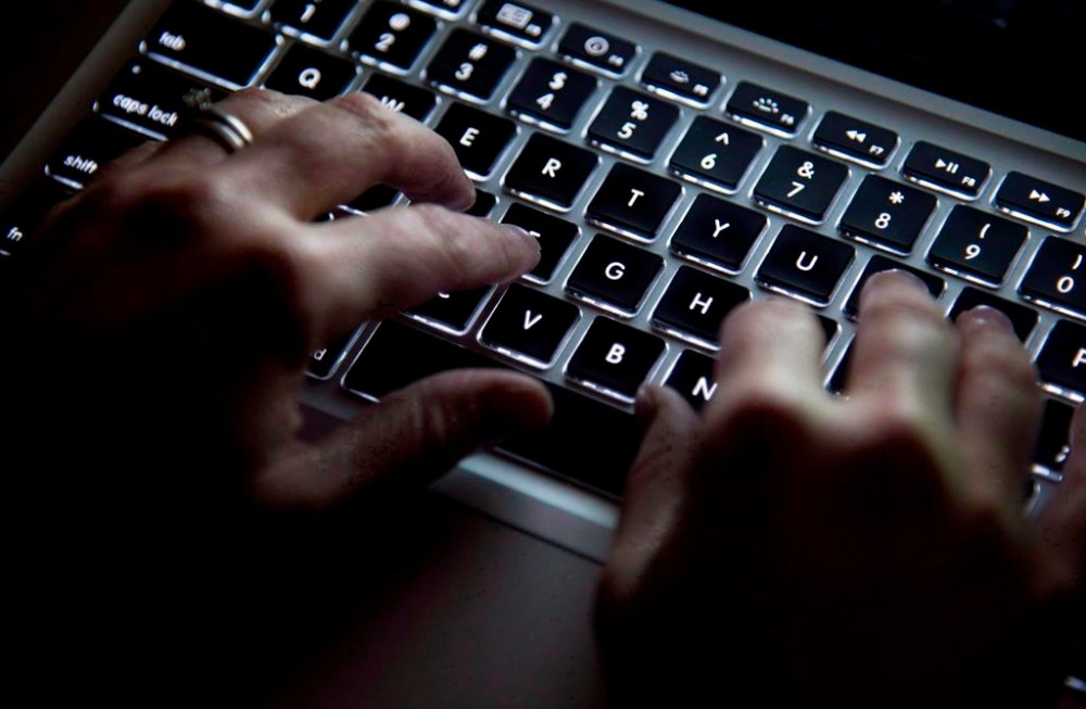 A woman uses a computer keyboard in North Vancouver, B.C., Wednesday, Dec. 19, 2012. Government websites in four provinces and territories are shut down, with at least two jurisdictions blaming the event on cyberattacks. THE CANADIAN PRESS/Jonathan Hayward