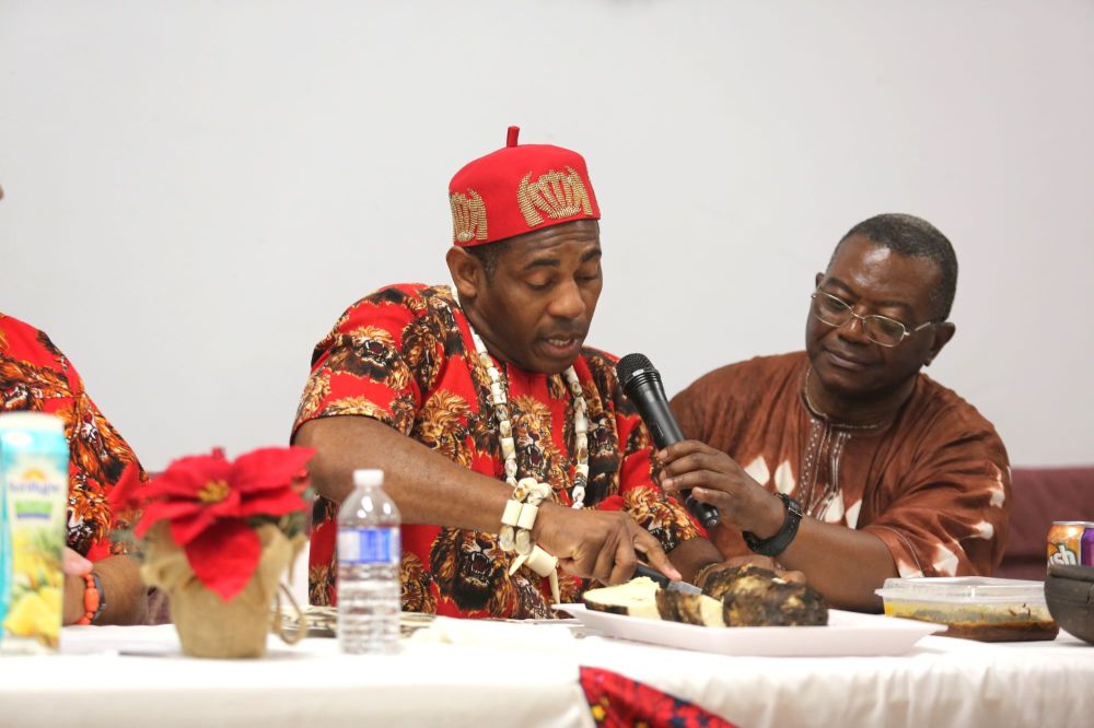 Umu Igbo Brandon Association Inc. chairman James Ahaneku cuts into and consumes some yams during Saturday’s Saturday’s Igbo Cultural Day and New Yam Festival at the Ukrainian Reading Association Hall. The New Yam Festival is traditionally practised throughout West Africa to celebrate the conclusion of a successful harvest season. (Kyle Darbyson/The Brandon Sun)