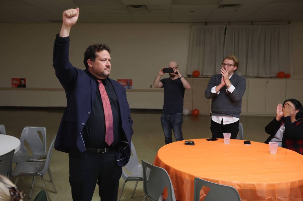 Brandon East NDP candidate Glen Simard cheers with supporters at the Brandon NDP campaign party at the Royal Canadian Legion Branch No. 3 on Victoria Avenue East on Tuesday evening after defeating Progressive Conservative incumbent Len Isleifson. (Tim Smith/The Brandon Sun)