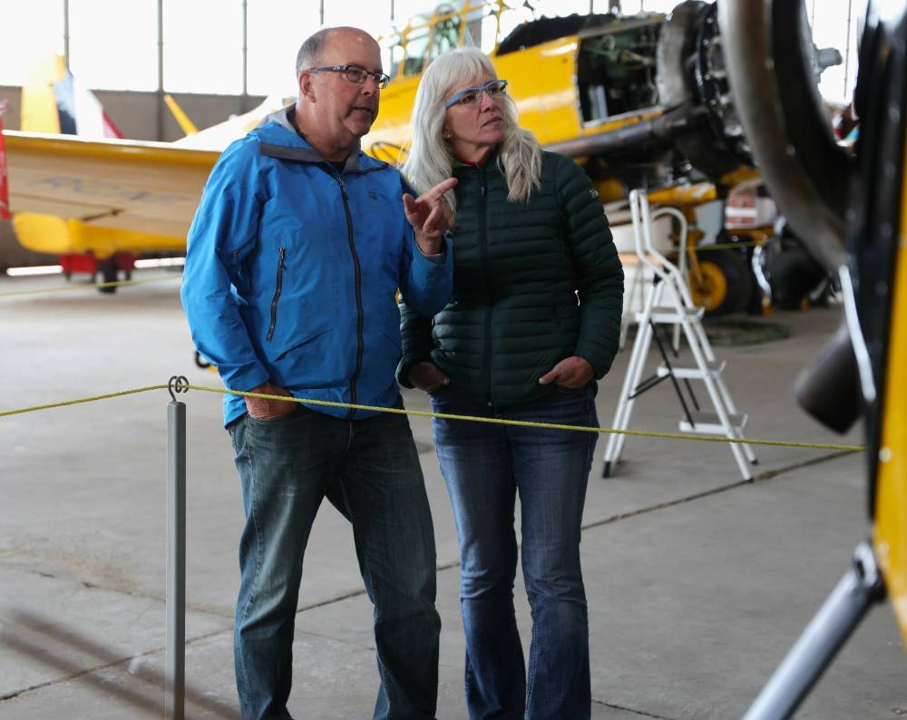 Jeff Mann and Ruth Jellicoe from Alberta admiring the planes on display at the Commonwealth Air Training Plan Museum (CATPM) in Brandon on Tuesday. (Michele McDougall/The Brandon Sun)
