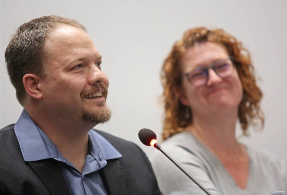 Byelection trustee candidate Sheri Miller, right, smiles as fellow candidate Kirk Carr jokes at his own lost train of thought while answering a question during the all-candidates forum on Wednesday evening at Brandon University's Evans Theatre. (Matt Goerzen/The Brandon Sun)