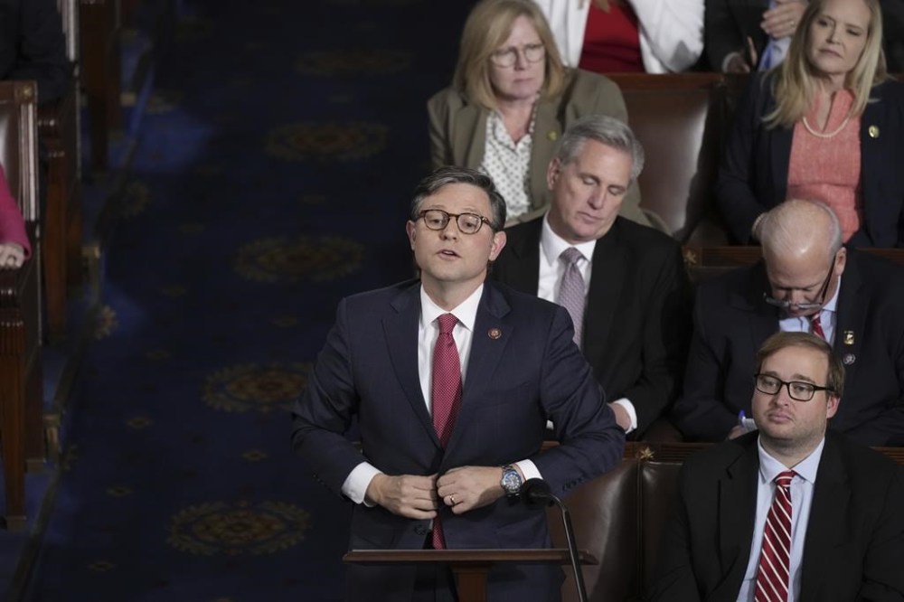 Rep. Mike Johnson, R-La., stands to vote for himself for speaker, as House Republicans try to elect a speaker, at the Capitol in Washington, Wednesday, Oct. 25, 2023. (AP Photo/J. Scott Applewhite)