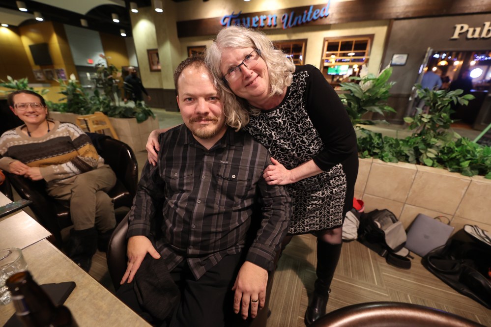 Kirk Carr (left) and Lorraine McConnell (right) embrace Wednesday evening after being elected to the Brandon School Division in a byelection. Carr was elected to serve in the urban Ward 1 and McConnell in the rural Ward 2. (Colin Slark/The Brandon Sun)