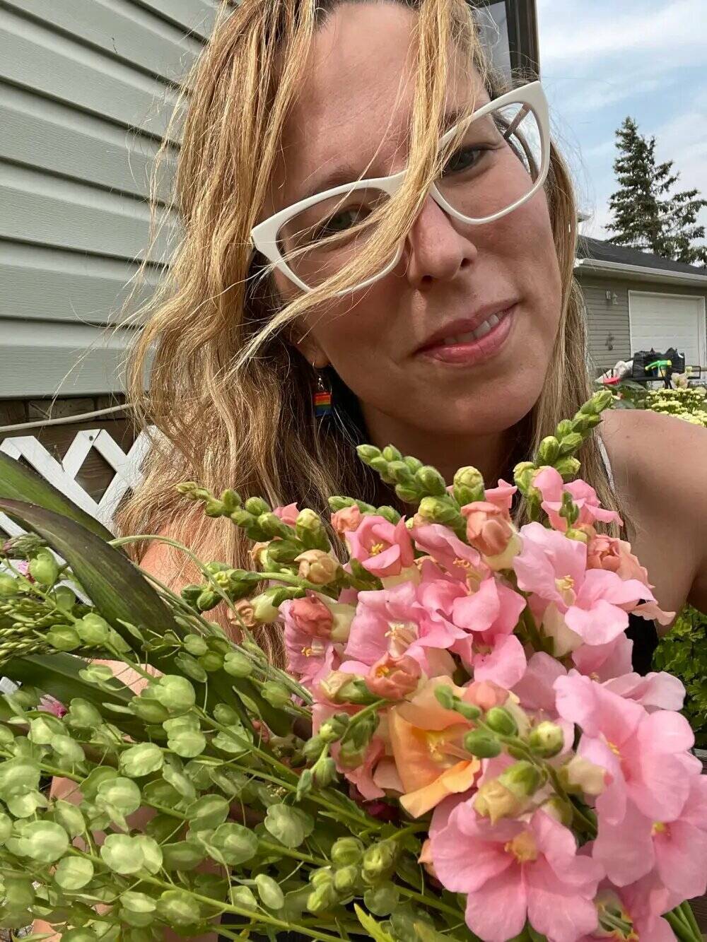 Leslie Halsall, flower farmer, with snapdragons, one of her favourite annual flower varieties. (Photo by Lyndon Penner)