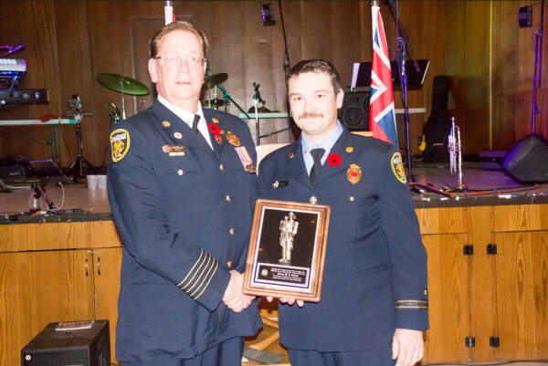 Dauphin Fire Chief Cam Abrey (left) presents Jordon Steiner with the Jack Carey Memorial Fire Fighter of the Year Award at the 122nd annual Firefighters’ Ball. (Dauphin Herald)