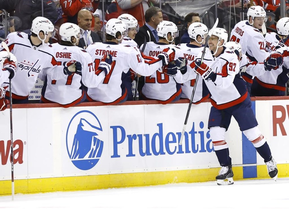 Washington Capitals center Evgeny Kuznetsov (92) is congratulated for his goal against the New Jersey Devils during the second period of an NHL hockey game Friday, Nov. 10, 2023, in Newark, N.J. (AP Photo/Noah K. Murray)