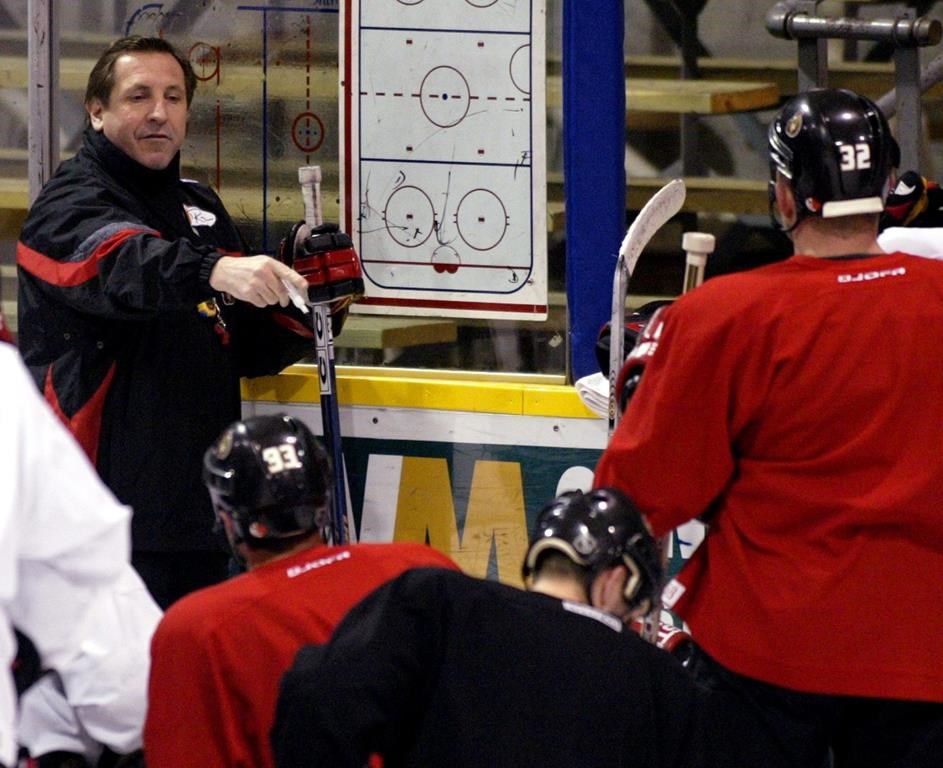 Ottawa Senators coach Jacques Martin talks to his players during practice in Ottawa on Tuesday April 6, 2003. Martin is back with the Ottawa Senators. The team announced Wednesday its former head coach has been appointed as a senior adviser to current bench boss D.J. Smith and his staff. THE CANADIAN PRESS/Tom Hanson