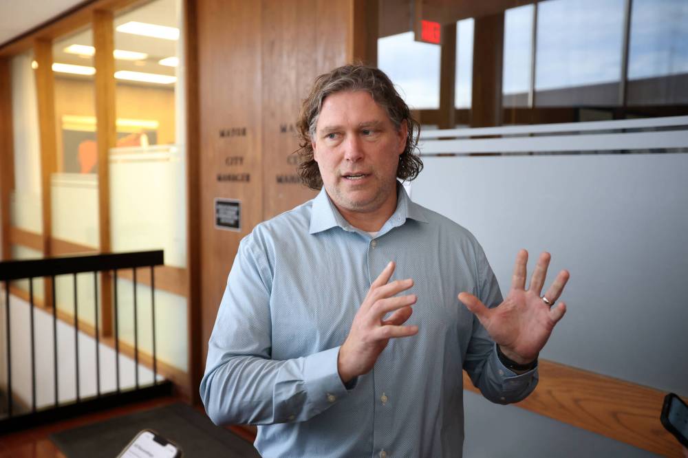 Brandon Mayor Jeff Fawcett speaks to members of the media outside his office following a press conference discussing a report that states the city is in a dire fiscal position. (Tim Smith/The Brandon Sun)