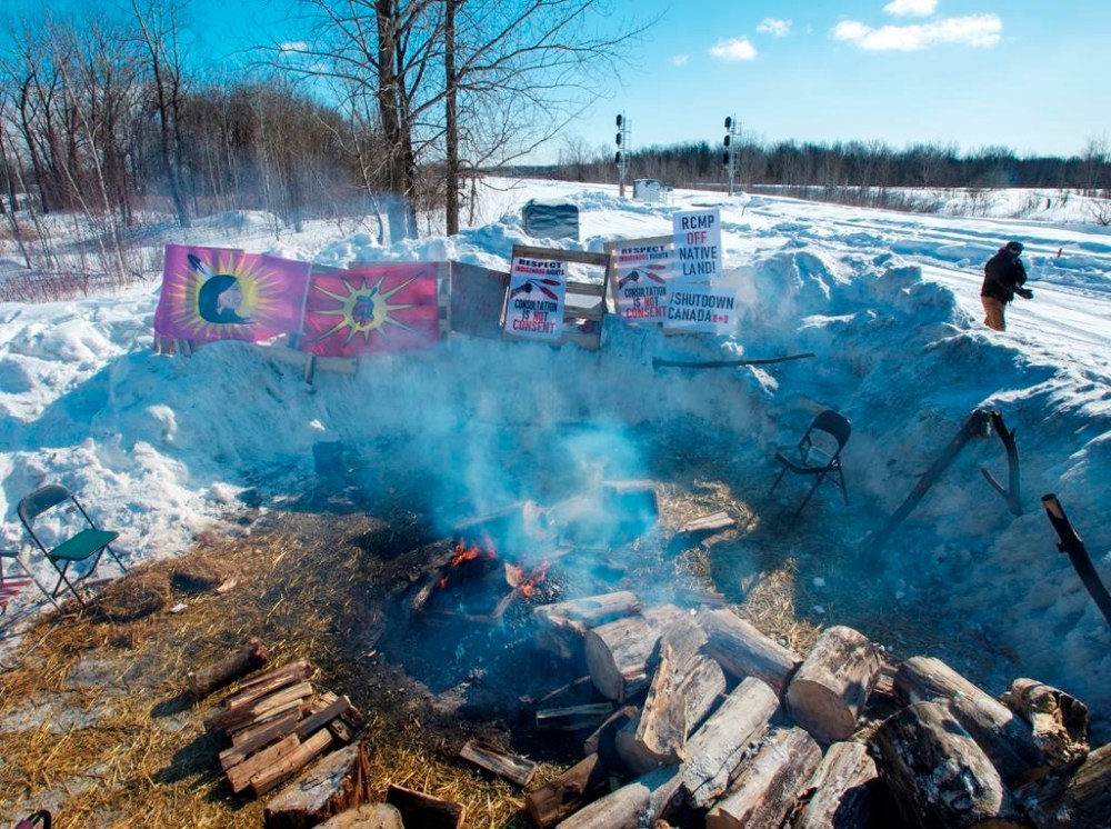 A rest area beside a blockade of the CN rail line is seen in Kahnawake, Que., Wednesday, Feb. 12, 2020. A council of twelve prominent Indigenous leaders tasked with advising CN Rail says it will resign effective on the last day of the year. THE CANADIAN PRESS/Ryan Remiorz