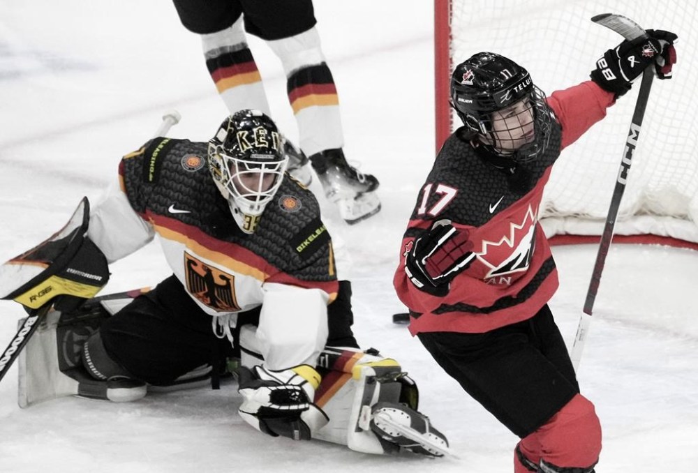 Canada's Macklin Celebrini (17) scores on Germany goaltender Matthias Bittner (1) during first period hockey action at the IIHF World Junior Hockey Championship in Gothenburg, Sweden, Sunday, Dec. 31, 2023. THE CANADIAN PRESS/Christinne Muschi