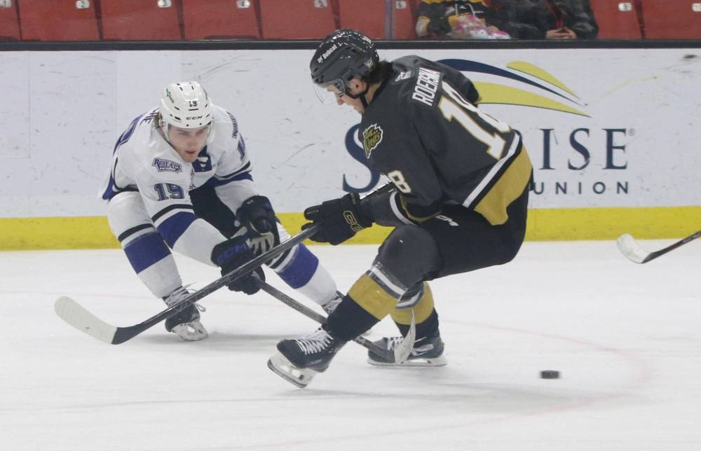 Victoria Royals forward Ben Riche (19) tips the puck away from Brandon Wheat Kings forward Rylen Roersma (18) during the second period of their Western Hockey League game at Westoba Place on Tuesday. (Perry Bergson/The Brandon Sun)