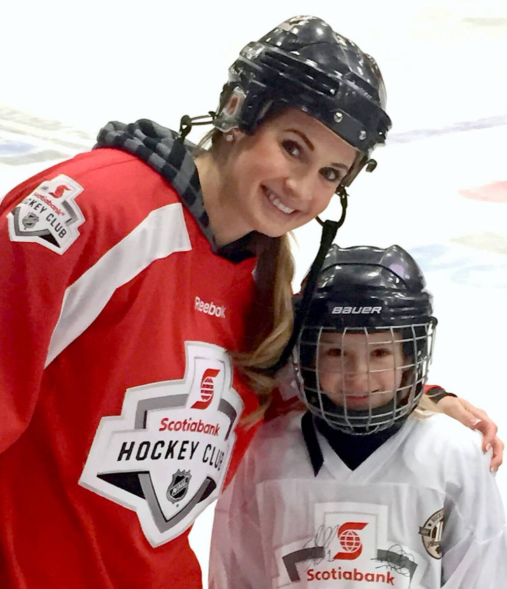 Two-time Olympic gold medallist Meaghan Mikkelson announced her retirement from the Canadian women's hockey team to pursue her broadcasting career in 2023. Here, she meets a young Karlyn Gudz during a Scotiabank hockey camp held in Brandon. (Submitted)