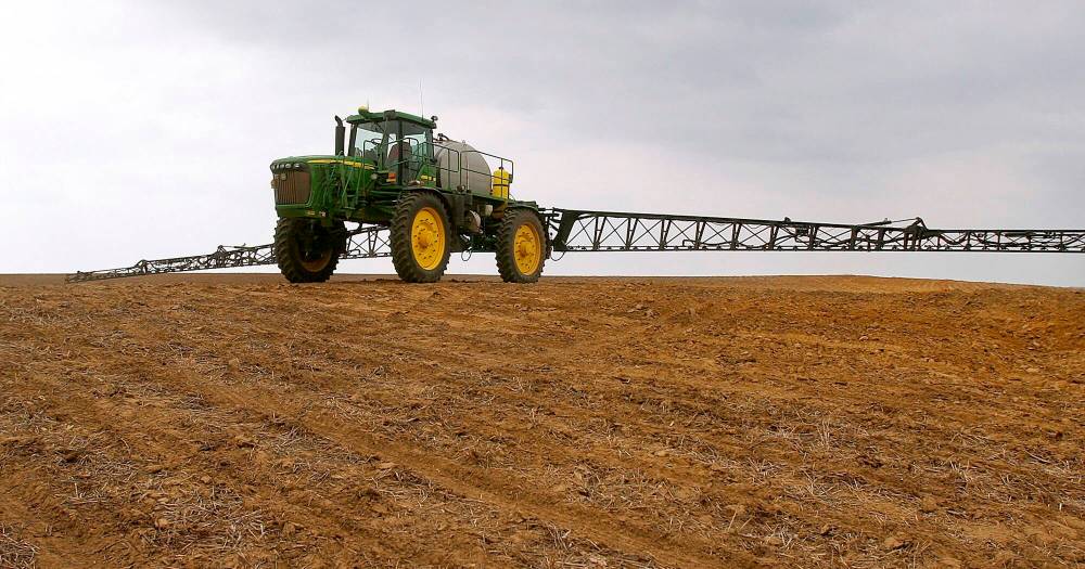 A farmer sprays herbicide at his farm. FCC has introduced a new program that encourages farmers to use methods that protect the environment. (File)