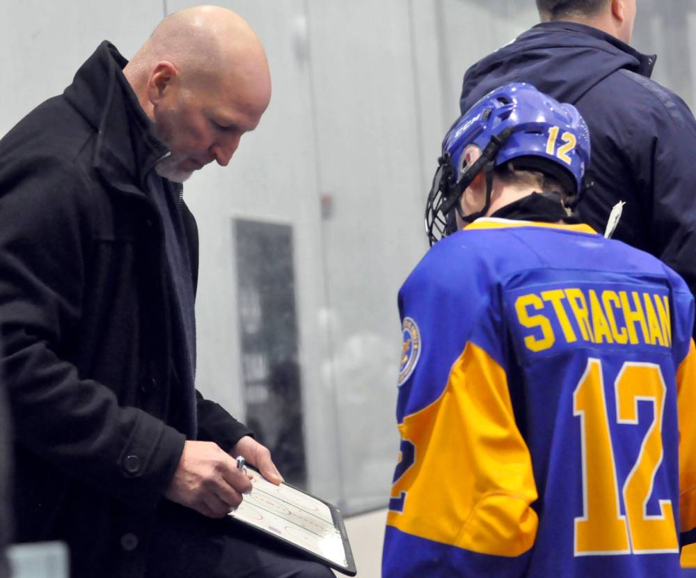 Yellowhead Chiefs assistant coach Craig Geekie goes over game strategy with veteran forward Alex Strachan during third-period action at J&G Homes Arena. (Photos Jules Xavier/The Brandon Sun)