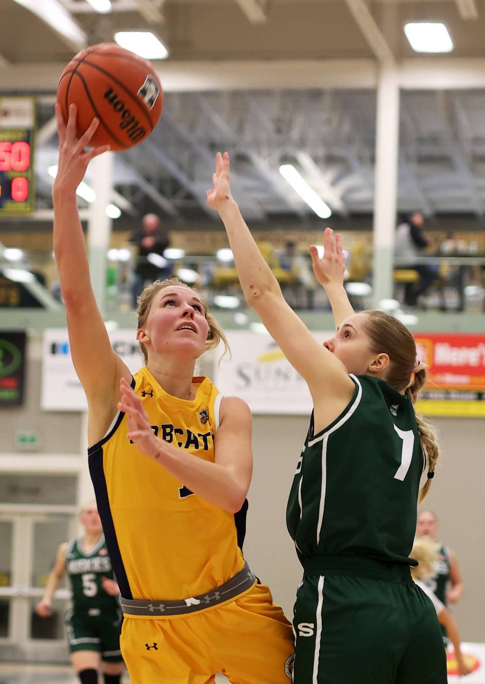 Brandon University Bobcat Reetta Tulkki (7) goes up for a layup while being defended by Saskatchewan Huskies Andrea Dodig (7) during U Sport women's basketball action at the Healthy Living Centre on Friday night. Tulkki scored a team-high 15 points in the 108-53 loss to the Huskies.
(Tim Smith/The Brandon Sun)