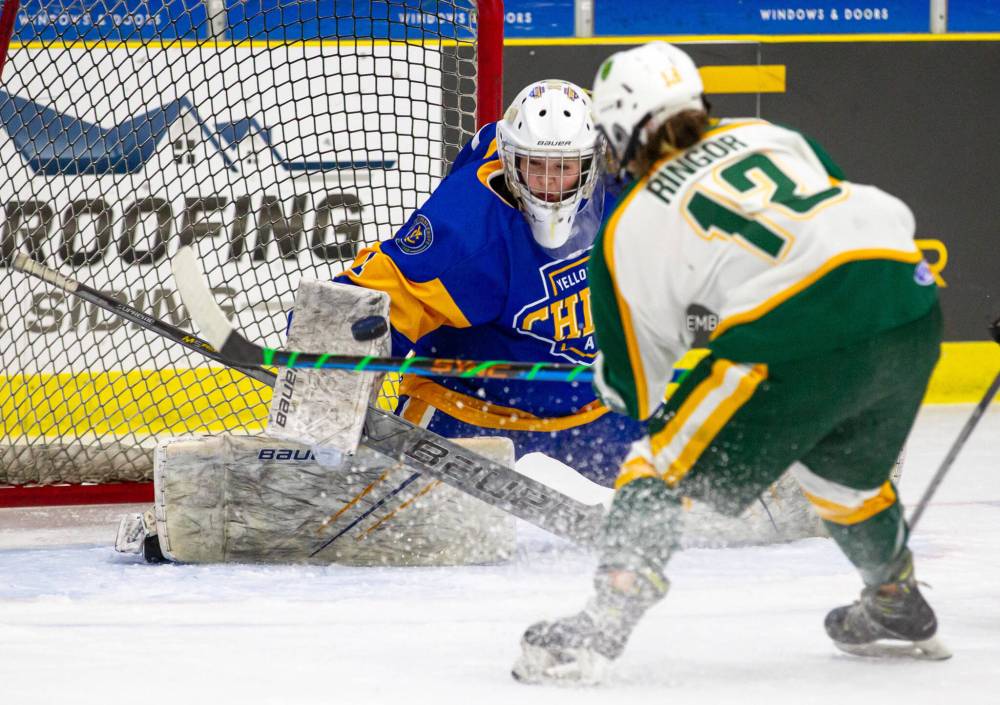 Yellowhead Chiefs goaltender Natalie Rampton uses her blocker to make a save. This fall she's off to Fremont, Neb., where she will play for the Midland University Warriors in the American Collegiate Hockey Association's West Div. 1 for coach Jason White. (Photo Zachary Peters)