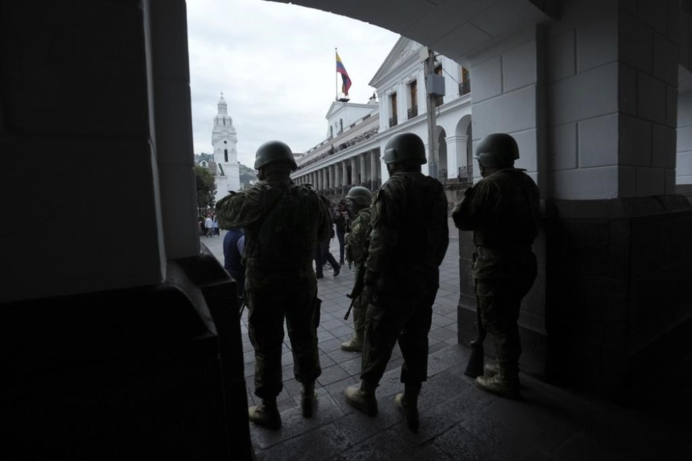 Soldiers patrol outside the government palace during a state of emergency in Quito, Ecuador, Tuesday, Jan. 9, 2024. The country has seen a series of attacks after the government imposed a state of emergency in the wake of the apparent escape of a powerful gang leader from prison. (AP Photo/Dolores Ochoa)