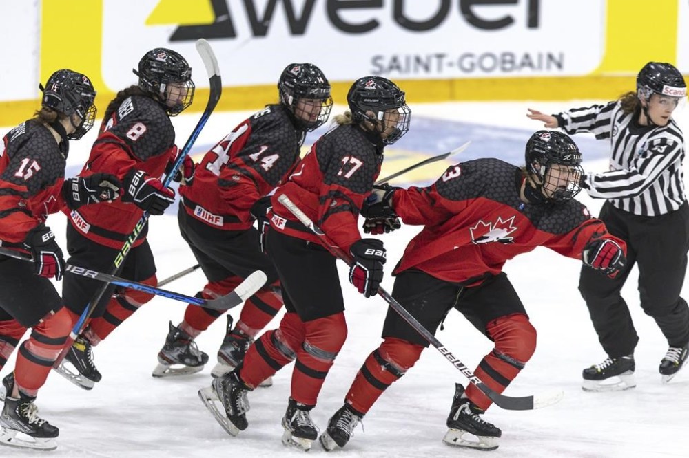 Canada's Caitlin Kraemer, foreground right celebrates scoring with teammates from left, Ava Murphy, Piper Grober, Emma Pais and Alex Law after scoring the opening goal during the Women's U18 Ice Hockey World Championship match between Canada and Sweden at the Ostersund Arena, in Ostersund, Sweden, Sunday, Jan. 15, 2023. THE CANADIAN PRESS/Per Danielsson/TT News Agency via AP