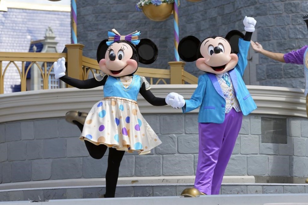 FILE - Minnie and Mickey Mouse perform for guests during a musical show in the Magic Kingdom at Walt Disney World, July 14, 2023, in Lake Buena Vista, Fla. Disney is hoping a recent decision bolstering a Florida prosecutor's First Amendment case against Gov. Ron DeSantis helps its own free speech lawsuit against the Florida governor. (AP Photo/John Raoux, File)