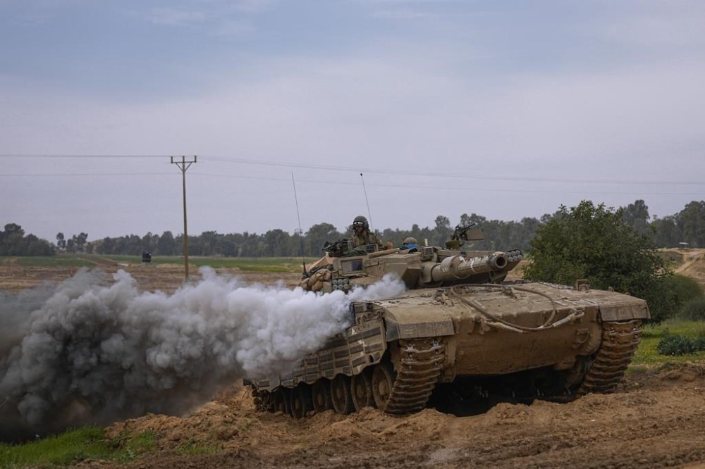 Israeli army tank moves near the Israeli-Gaza border, in southern Israel, Wednesday, Jan. 17, 2024.(AP Photo/Ohad Zwigenberg)