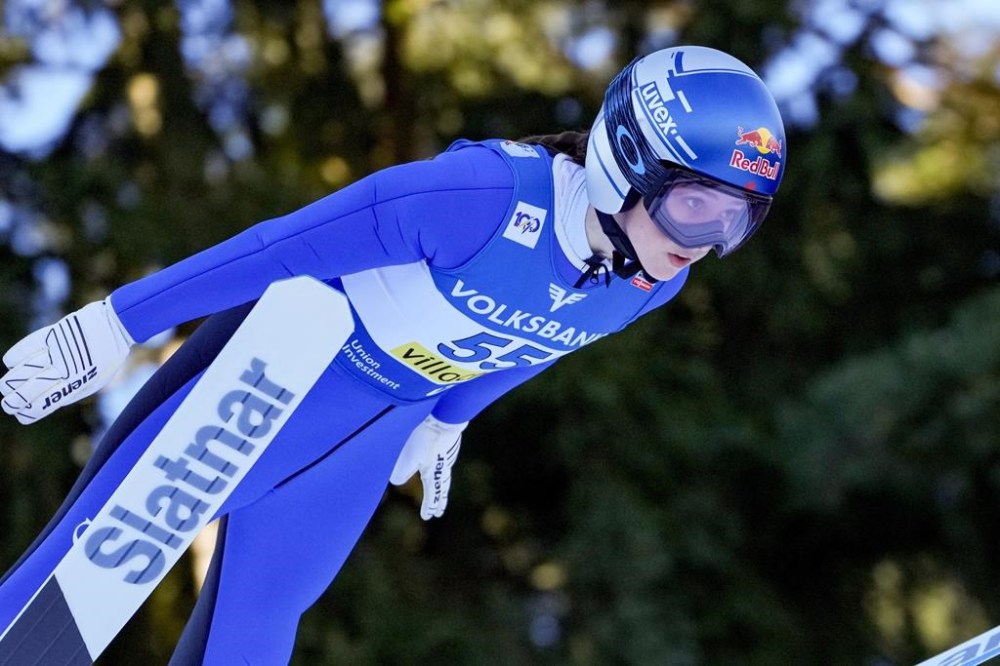 Canada's Alexandria Loutitt competes at the Women Normal Hill Individual Ski Jumping World Cup event in Villach, Austria, Thursday, Jan. 4, 2024. Loutitt soared to World Cup bronze in women’s ski jumping on Friday. THE CANADIAN PRESS/AP/Darko Bandic