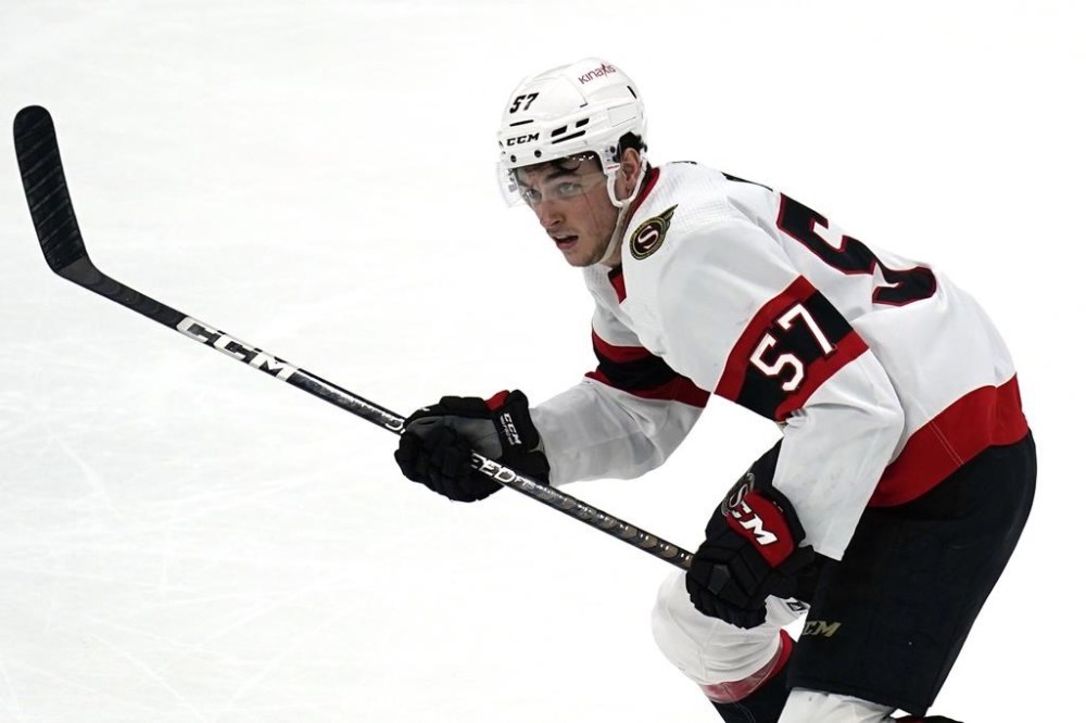 Ottawa Senators center Shane Pinto (57) plays during an NHL hockey game against the Bosotn Bruins Tuesday, March 21, 2023, in Boston. Pinto is one step closer to resuming his NHL career. The Senators signed the centre to a one-year, US$775,000 contract on Friday after he was suspended 41 games for