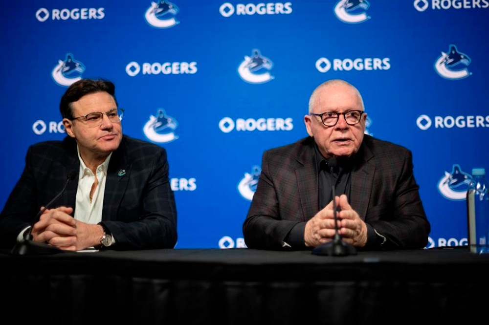 Francesco Aquilini, chairman and governor for Vancouver Canucks, listens as Jim Rutherford responds to a question during a press conference following the announcement of his contract extension as president of hockey operation of the Vancouver Canucks, at Rogers Arena in Vancouver, on Friday, January 19, 2024. THE CANADIAN PRESS/ Tijana Martin