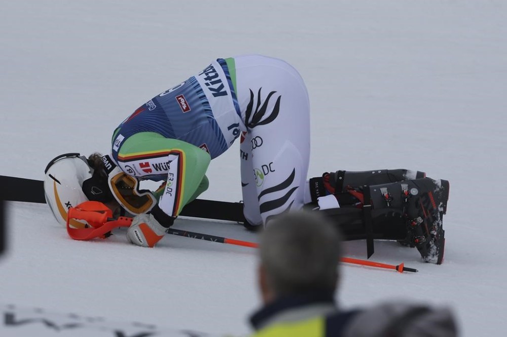 Germany's Linus Strasser kisses the snow after winning an alpine ski, men's World Cup slalom race, in Kitzbuehel, Austria, Sunday, Jan. 21, 2024. (AP Photo/Marco Trovati)