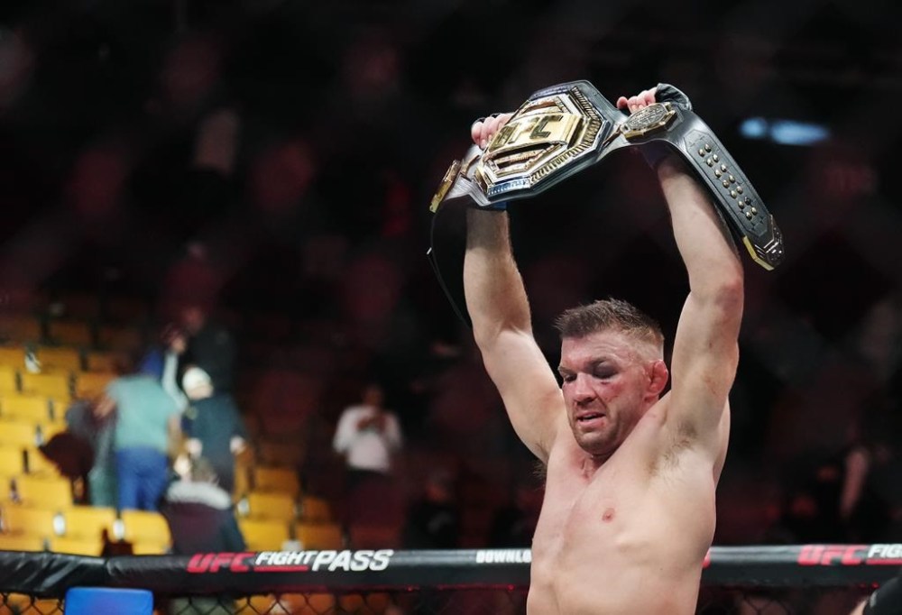 Dricus Du Plessis celebrates after defeating Sean Strickland in a middleweight title bout at UFC 297 in Toronto on Sunday, January 21, 2024. THE CANADIAN PRESS/Nathan Denette