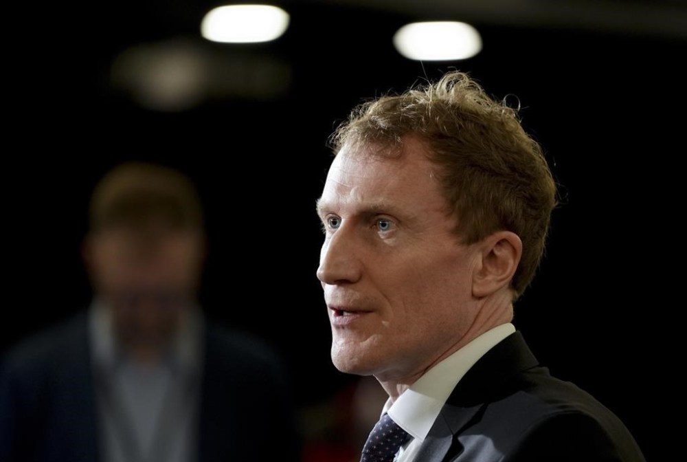 Minister of Immigration, Refugees and Citizenship Marc Miller speaks to the media during the federal cabinet retreat in Montreal, Monday, Jan. 22, 2024. THE CANADIAN PRESS/Christinne Muschi