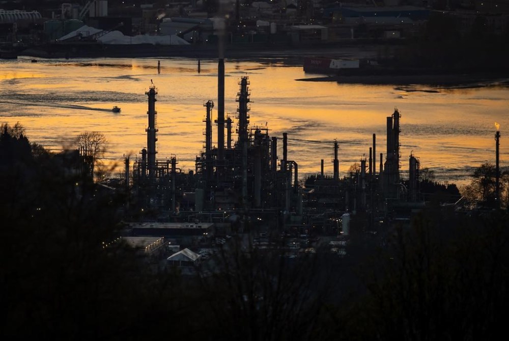 An activist investor says Parkland Corp. needs a complete board overhaul following the recent resignations of two board members. A boat travels past the Parkland Burnaby Refinery on Burrard Inlet at sunset in Burnaby, B.C., Saturday, April 17, 2021. THE CANADIAN PRESS/Darryl Dyck