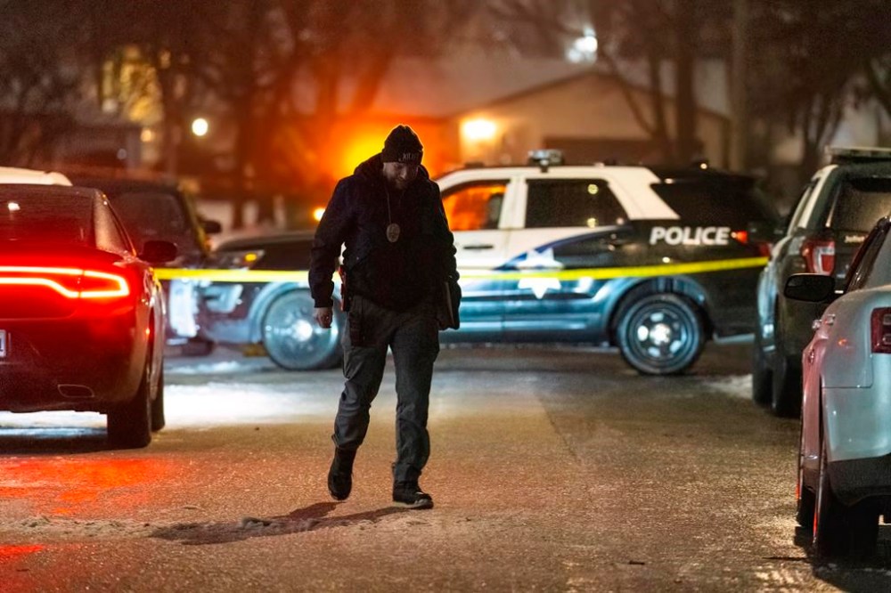 Police work a scene, Monday, Jan. 22, 2024, in Joliet, Ill., after multiple people were shot and killed over two days at three locations in the Chicago suburbs. (Tyler Pasciak LaRiviere/Chicago Sun-Times via AP)