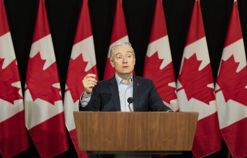 Minister of Innovation, Science and Industry Francois-Philippe Champagne speaks to the media during the federal cabinet retreat in Montreal, Monday, Jan. 22, 2024. THE CANADIAN PRESS/Christinne Muschi