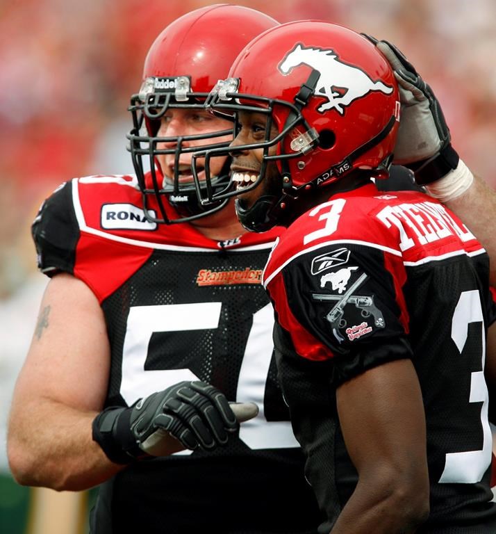 Jay McNeil is the new president of the Calgary Stampeders. Calgary Stampeders Ryan Thelwell, right, celebrates his touchdown with McNeil during first half CFL football action against the Edmonton Eskimos in Calgary, Alta., Monday, Sept. 3, 2007. THE CANADIAN PRESS/Jeff McIntosh